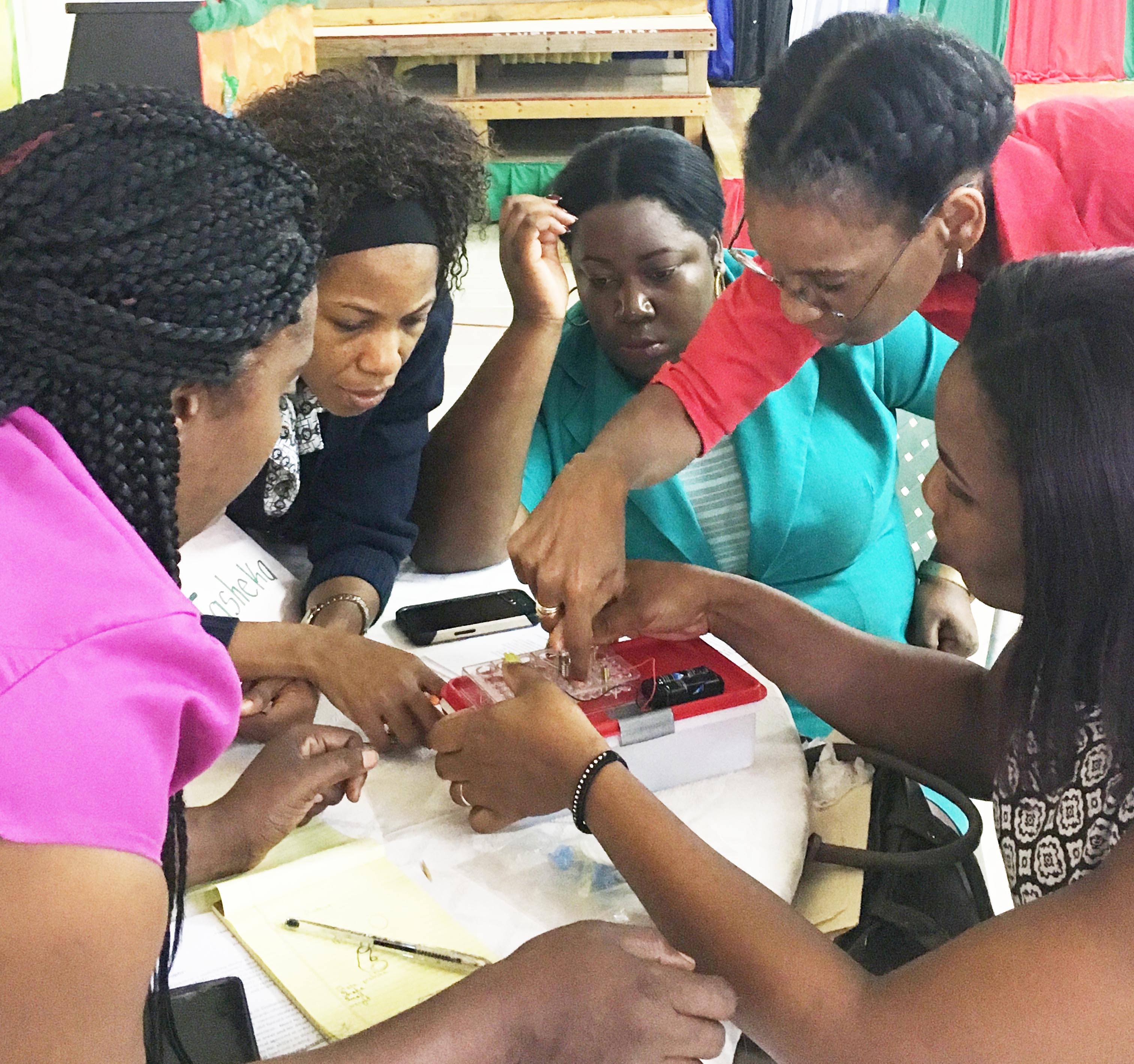 Jamaica_teachers_building_series_and_parallel_circuits_with_assistance_from_Dr_Cathy_Radix.JPG